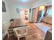 Dining area connected to a kitchen with a wooden table and white chairs at 3226 Hope St, Hapeville, GA 30354