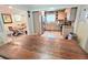 Dining area with wood table and chairs leading into the kitchen with stainless steel appliances at 3226 Hope St, Hapeville, GA 30354