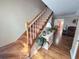 Welcoming foyer with wood floors, staircase, and decorative plants at 3226 Hope St, Hapeville, GA 30354