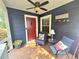 Cozy front porch with comfortable seating, ceiling fan, and welcoming decor at 3226 Hope St, Hapeville, GA 30354