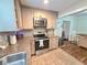 Charming kitchen featuring granite countertops, stainless steel appliances, and a tiled backsplash at 3226 Hope St, Hapeville, GA 30354