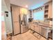 Bright kitchen featuring stainless steel appliances, granite countertops, and ample cabinet space at 3226 Hope St, Hapeville, GA 30354
