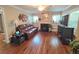 Comfortable living room featuring hardwood floors, fireplace, and ample natural light at 3226 Hope St, Hapeville, GA 30354