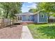 Charming backyard with a small deck, brick patio, and green lawn at 588 Angier Ne Ave, Atlanta, GA 30308