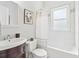 Bright bathroom with tub/shower combo, subway tile, and updated vanity at 588 Angier Ne Ave, Atlanta, GA 30308