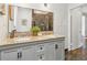 Bathroom with dual sink vanity, granite counters, gray cabinets, and a large mirror at 588 Angier Ne Ave, Atlanta, GA 30308