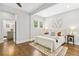 Inviting bedroom with hardwood floors, a large window, and stylish decor at 588 Angier Ne Ave, Atlanta, GA 30308