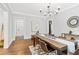 Well-lit dining room with hardwood floors, stylish furnishings, and a contemporary chandelier at 588 Angier Ne Ave, Atlanta, GA 30308