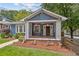 Charming craftsman-style home with a covered front porch, landscaped yard, and inviting curb appeal at 588 Angier Ne Ave, Atlanta, GA 30308
