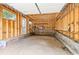 Unfinished detached garage interior with exposed framing, wood studs, and concrete floor at 588 Angier Ne Ave, Atlanta, GA 30308