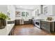 Well-lit kitchen with stainless steel appliances, stylish cabinets and hardwood floors at 588 Angier Ne Ave, Atlanta, GA 30308