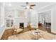 Cozy living room with a white brick fireplace, hardwood floors, and ample natural light at 588 Angier Ne Ave, Atlanta, GA 30308