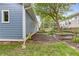 Side yard with landscaping, garden beds, and exterior of home with light blue siding at 588 Angier Ne Ave, Atlanta, GA 30308
