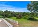 Spacious backyard with well-maintained lawn and white fence, perfect for outdoor activities at 2595 Ross Rd, Snellville, GA 30039