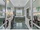 En-suite bathroom with and vanities, a soaking tub, and marble floors at 2595 Ross Rd, Snellville, GA 30039