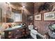 Quaint powder room with antique vanity, statement wallpaper, and decorative accents at 2595 Ross Rd, Snellville, GA 30039