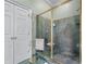 Shower stall with glass enclosure, marble walls and gold-tone hardware at 2595 Ross Rd, Snellville, GA 30039