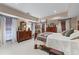 Spacious bedroom with neutral tones, large windows, and a comfortable bed at 2595 Ross Rd, Snellville, GA 30039