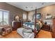 Bedroom with a four poster bed, wood floors, area rug, and accent chair at 2595 Ross Rd, Snellville, GA 30039