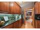 Butler's pantry featuring elegant wood cabinetry, granite countertops, and a sink at 2595 Ross Rd, Snellville, GA 30039