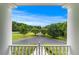 Scenic front view from the porch overlooking the driveway, landscape, and trees at 2595 Ross Rd, Snellville, GA 30039