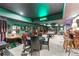 Entertainment space with a pool table, seating, and a vintage neon billiards sign at 2595 Ross Rd, Snellville, GA 30039