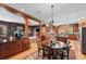 Expansive kitchen and dining area features wood cabinets, stainless steel appliances, and a large island at 2595 Ross Rd, Snellville, GA 30039
