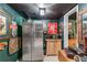 Compact kitchen area with stainless steel refrigerator and wooden cabinetry, decorated with vintage items at 2595 Ross Rd, Snellville, GA 30039