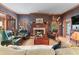 Cozy living room with a fireplace, comfortable seating, and traditional decor at 2595 Ross Rd, Snellville, GA 30039