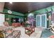 Spacious living area with a dark green color scheme, large TV, and seating area at 2595 Ross Rd, Snellville, GA 30039