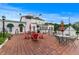 Outdoor patio area with brick flooring, outdoor seating, and views of the property at 2595 Ross Rd, Snellville, GA 30039