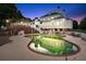 Stunning outdoor pool area with elegant pool, patio, and home in the background at 2595 Ross Rd, Snellville, GA 30039