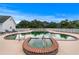 Beautiful backyard pool and spa surrounded by a white fence and lush greenery at 2595 Ross Rd, Snellville, GA 30039