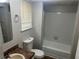 Clean bathroom features a shower-tub combination and neutral fixtures at 3951 Mcgill Dr, Decatur, GA 30034