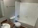 Clean, well-lit bathroom includes a bathtub with shower and vanity sink at 3951 Mcgill Dr, Decatur, GA 30034