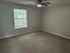 Comfortable bedroom with modern ceiling fan and window at 3951 Mcgill Dr, Decatur, GA 30034