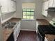 Functional kitchen with white cabinets, stainless steel appliances, and laminate countertops at 3951 Mcgill Dr, Decatur, GA 30034