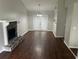 Open living room boasts a stone fireplace and double doors leading to the outdoors at 3951 Mcgill Dr, Decatur, GA 30034