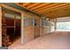 Barn featuring several stalls, wooden beams, and open space at 228 Indian Creek Rd, Locust Grove, GA 30248