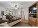 A large bedroom with hardwood floors and a ceiling fan at 228 Indian Creek Rd, Locust Grove, GA 30248