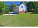 Exterior showing garage with brick accents, truck parked on driveway, and manicured lawn at 228 Indian Creek Rd, Locust Grove, GA 30248