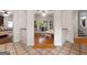 An arched hallway featuring tile floors and leading to several rooms at 228 Indian Creek Rd, Locust Grove, GA 30248