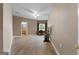 Spacious living room boasts hardwood floors, a ceiling fan, and a window offering natural light and scenic views at 228 Indian Creek Rd, Locust Grove, GA 30248