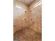 Luxurious tiled shower with multiple shower heads at 228 Indian Creek Rd, Locust Grove, GA 30248