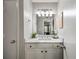 Bathroom vanity with a white sink, marble countertop, and updated fixtures at 3063 Chastain Park Ne Ct, Atlanta, GA 30342