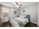 Comfortable bedroom with hardwood floors, ceiling fan, and ample natural light at 3063 Chastain Park Ne Ct, Atlanta, GA 30342