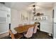 Cozy dining area featuring a modern table and chairs, complemented by decorative shelving at 3063 Chastain Park Ne Ct, Atlanta, GA 30342