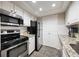 Kitchen view of stainless steel appliances, white cabinets, and granite countertops at 3063 Chastain Park Ne Ct, Atlanta, GA 30342