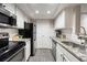 Bright kitchen featuring white cabinets, stainless steel appliances, and granite countertops at 3063 Chastain Park Ne Ct, Atlanta, GA 30342