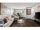 Comfortable living room area with hardwood flooring, a modern desk and natural light at 3063 Chastain Park Ne Ct, Atlanta, GA 30342